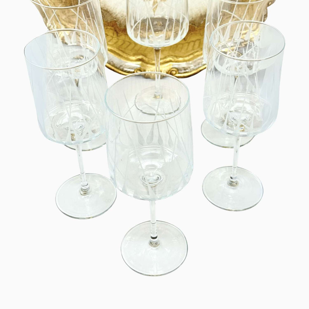 Set of clear wine glasses on a white background