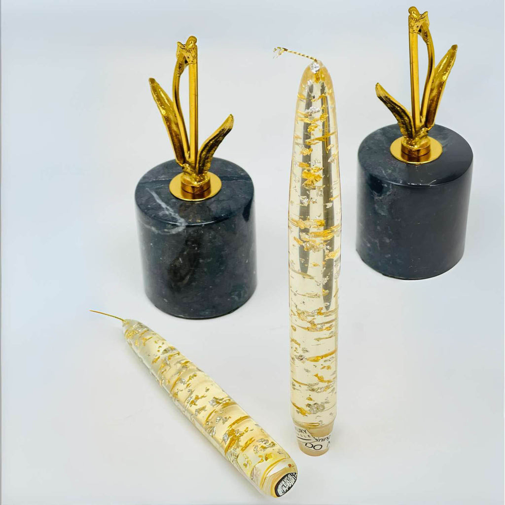 Decorative items with gold accents on a white background