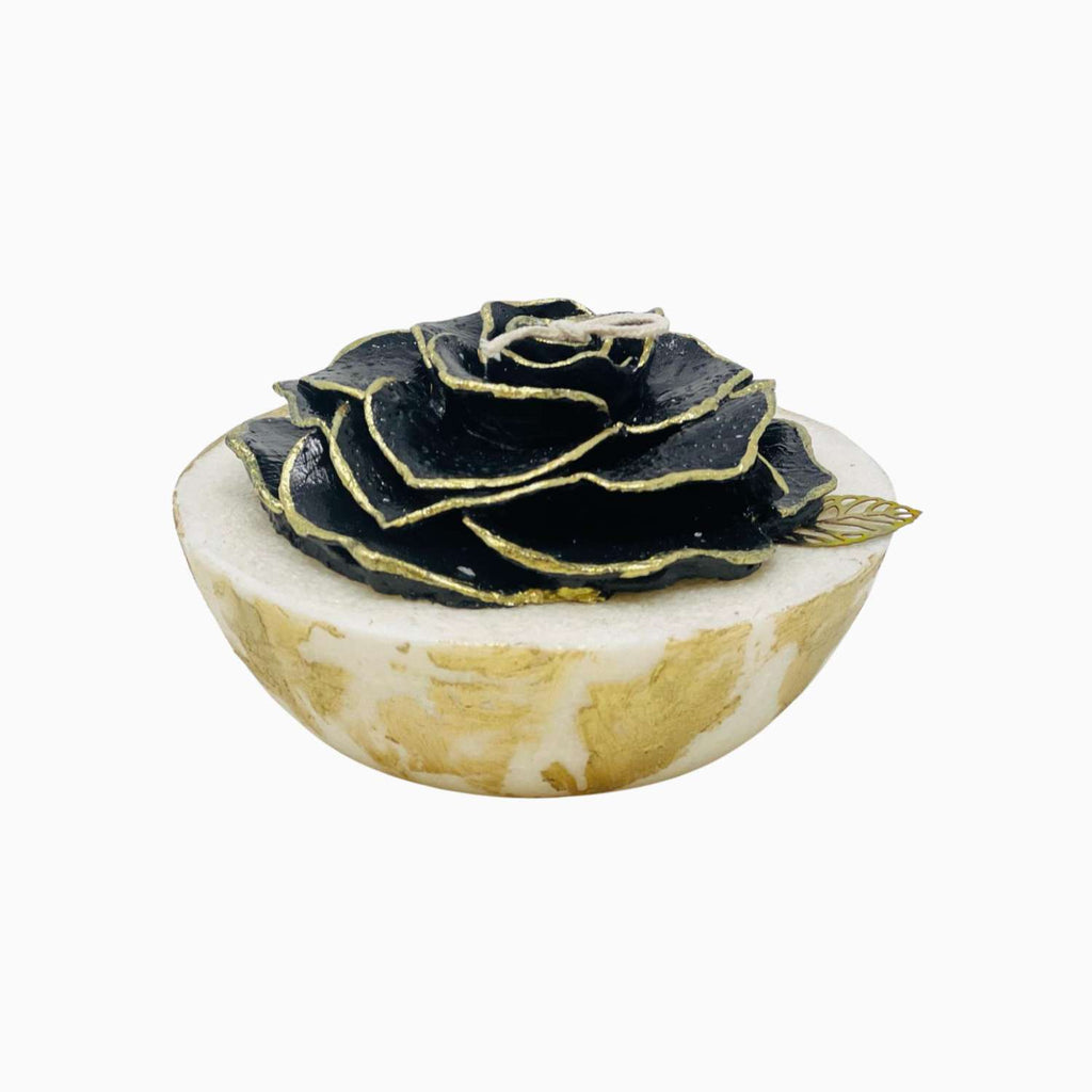 Decorative CANDLE with black rose on a white background