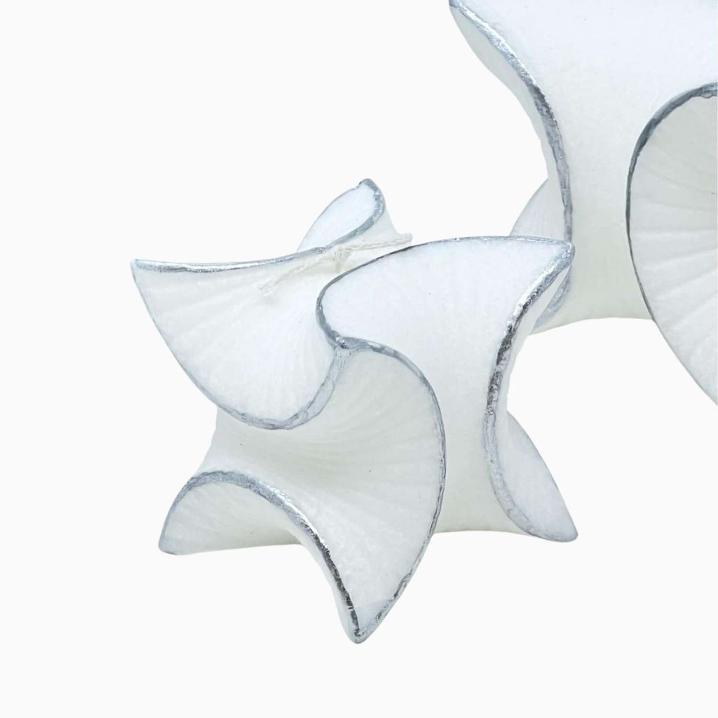 Star-shaped candle on a white background