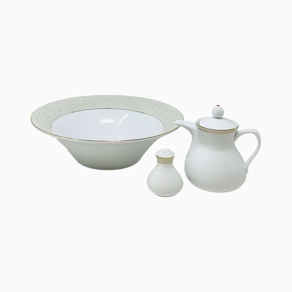 Set of white ceramic tableware including a bowl, pitcher, and salt shaker on a white background