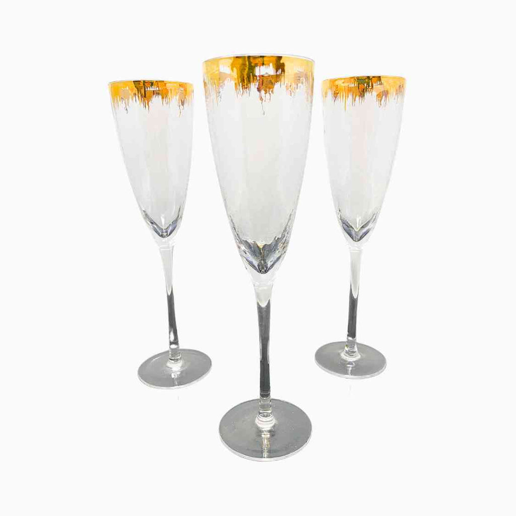 FOUR-PIECE GOLD RIM HAMMERED STEMWARE