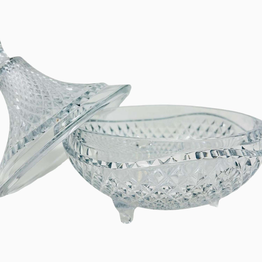 Clear glass bowl with a lid on a white background