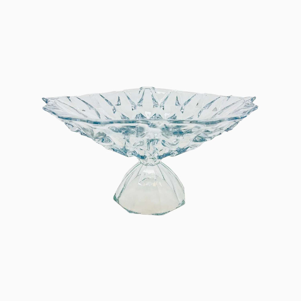 Clear glass footed bowl on a white background