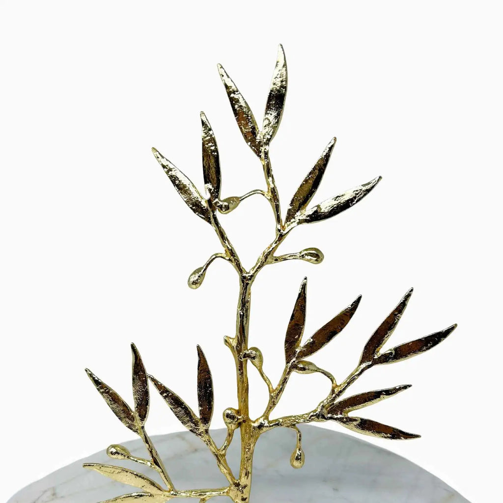 Gold leaf decorative piece on a white background