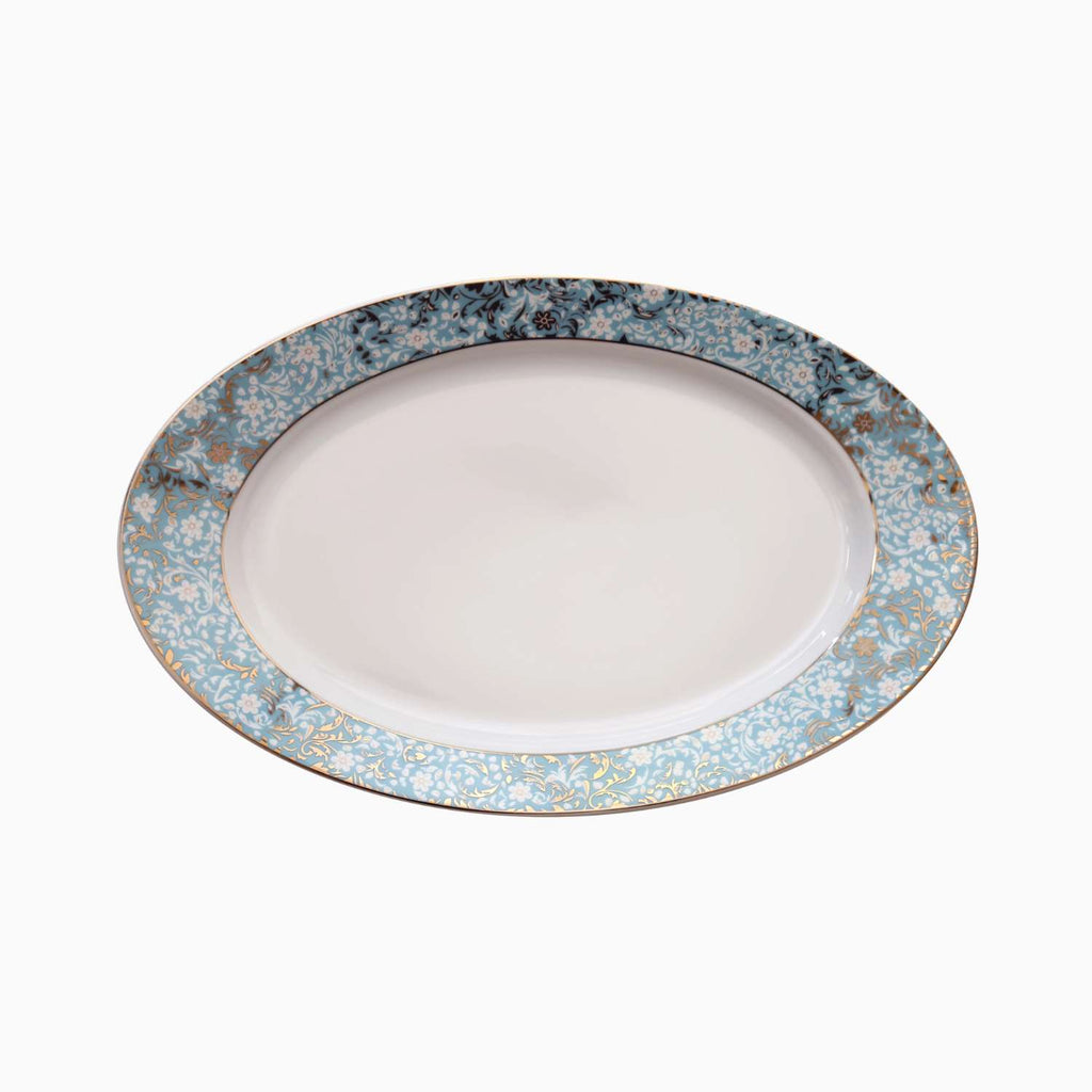 White plate with a decorative blue floral rim on a white background