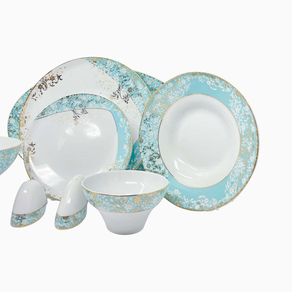 Ceramic dinnerware set with blue floral patterns on a white background