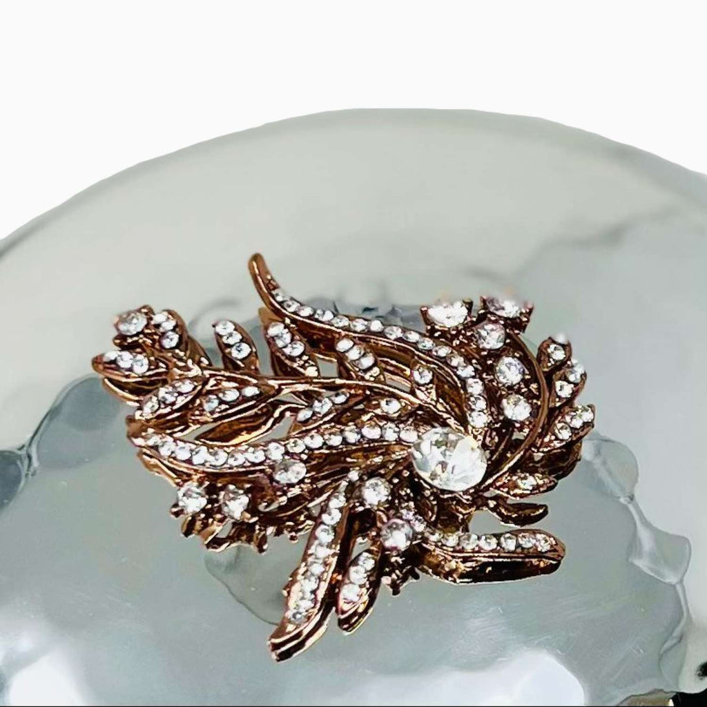 Decorative lid with rose gold on a white background