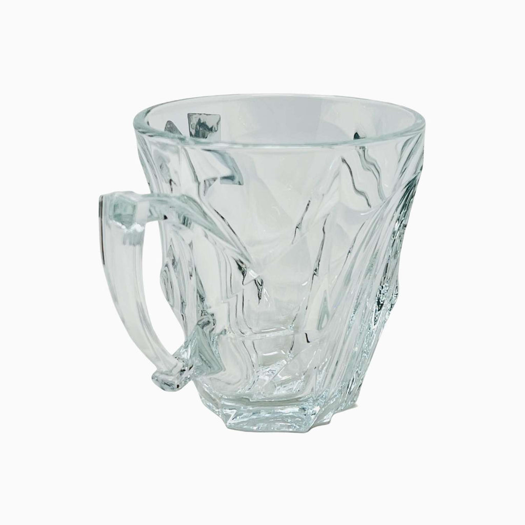 Clear glass mug with a handle on a white background