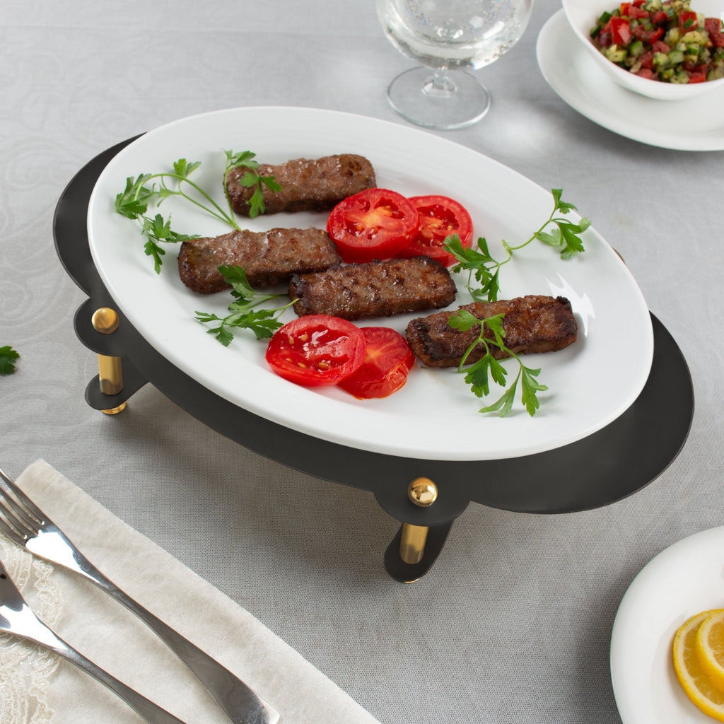 WHITE OVAL SERVING PLATE ON BLACK AND GOLD STAND