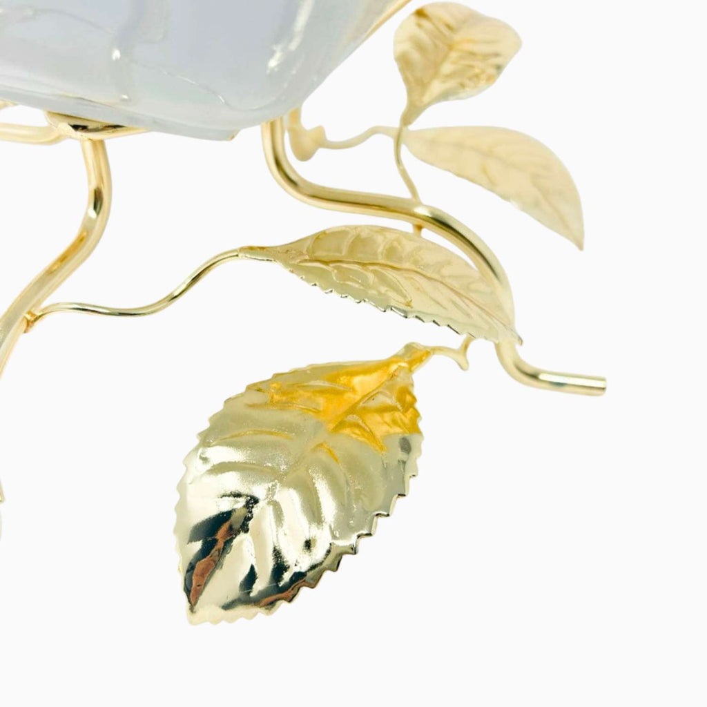 Gold leaf design on a white background