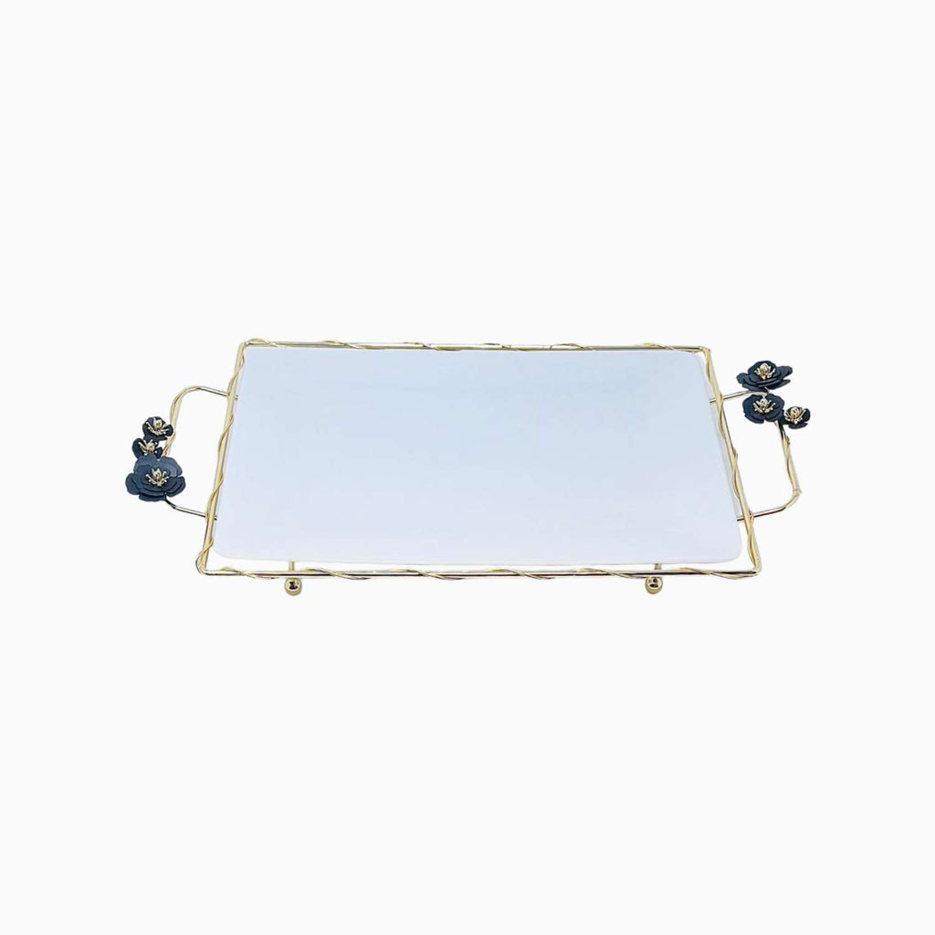 Rectangular serving plate with gold frame and blue floral handles on a white background